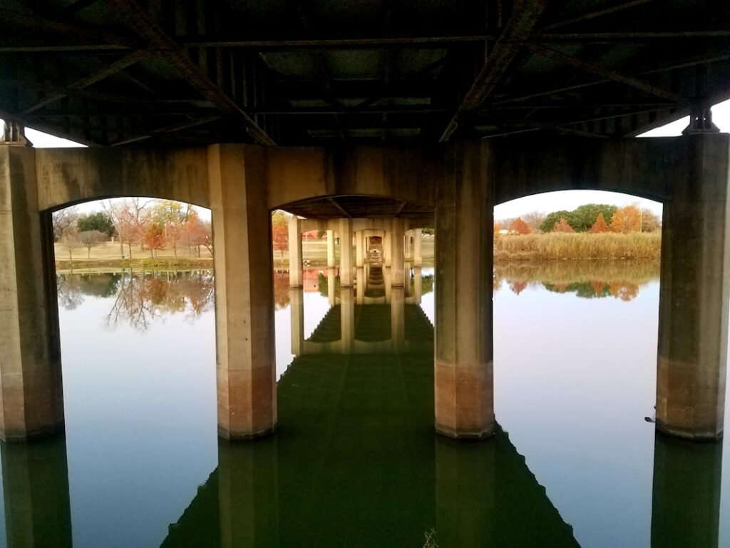 brown wooden bridge over river