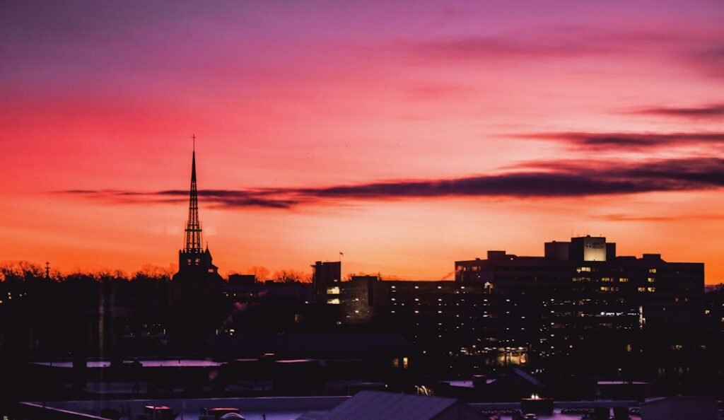 silhouette of city buildings during sunset