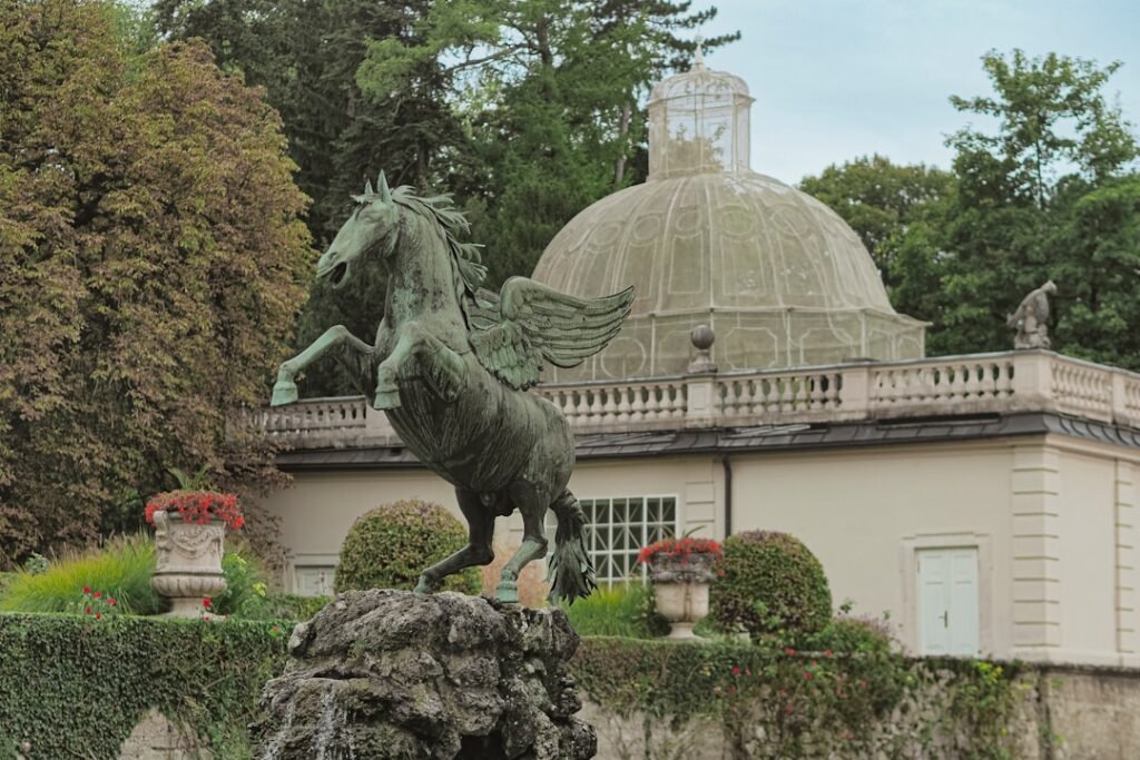 Pegasus statue in front of a domed building